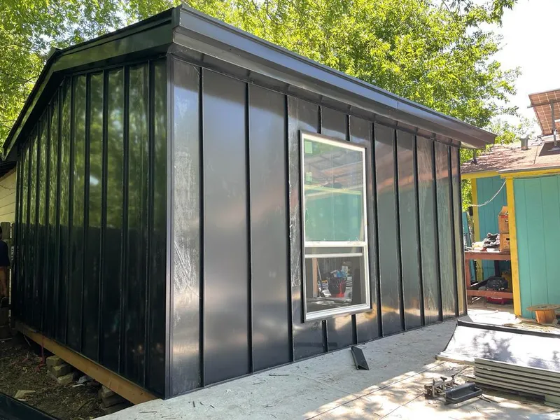 Black standing seam metal wall panels for Roof Inspection in Culver City