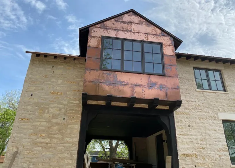 Copper metal panel facade on a stone building for Metal Roof Coating in Culver City