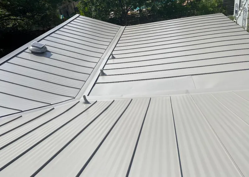 Solar attic fan installed on a metal roof for Roof Ventilation in Culver City